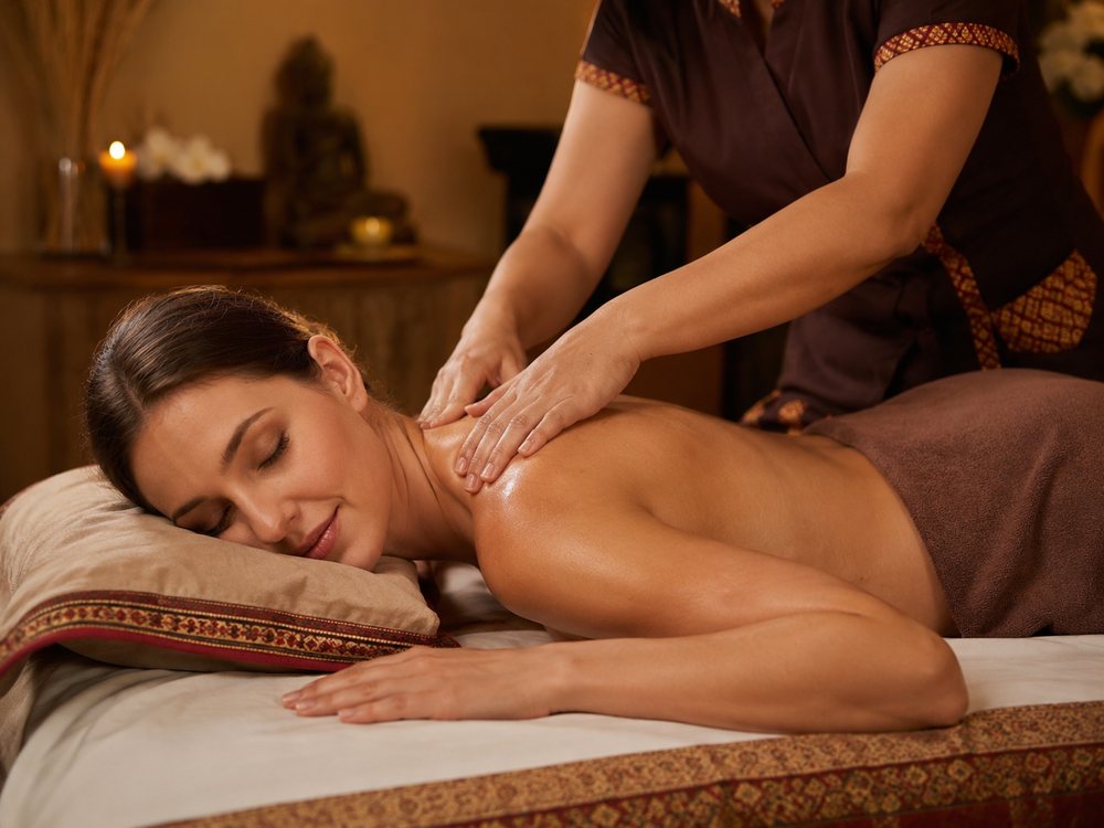 Thai massage with oil on the massage bed