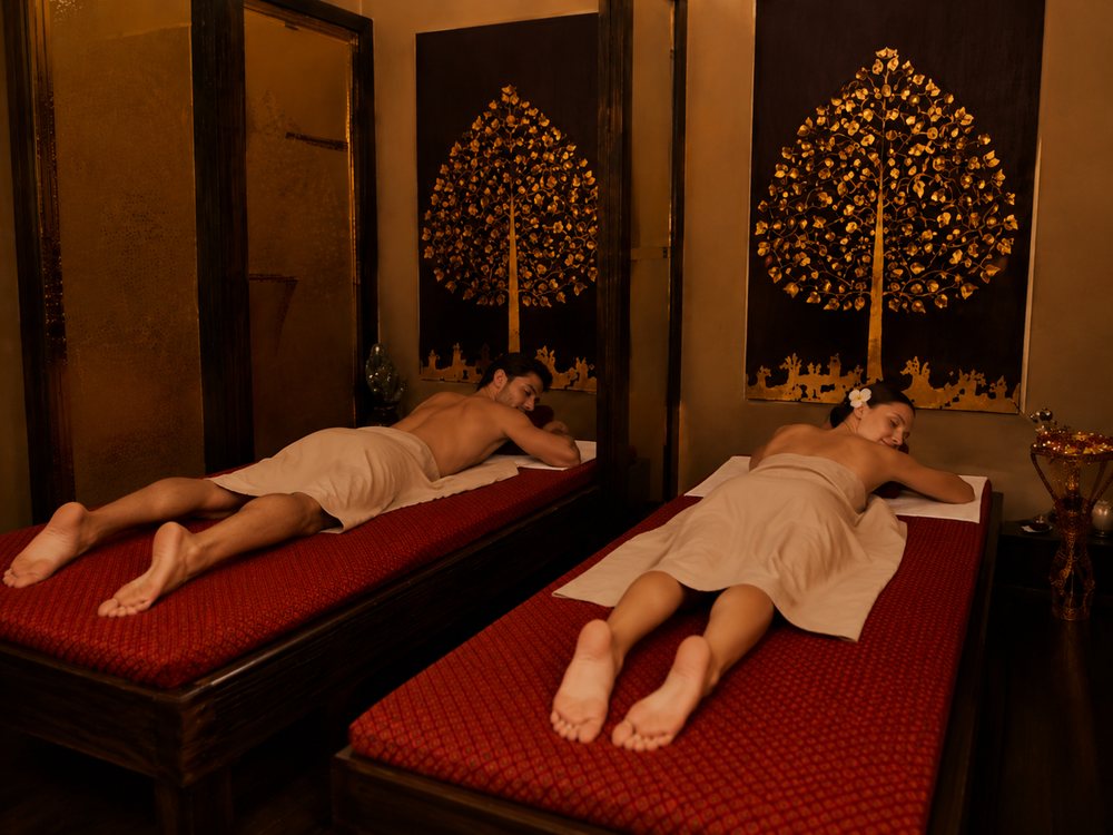 Couples massage on two beds in the same room
